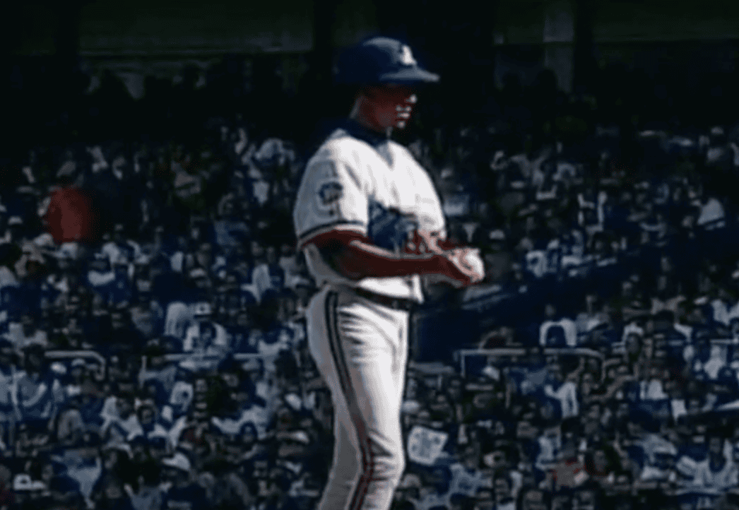 Pedro Martinez pitching for the Montreal Expos, showcasing his dominance.